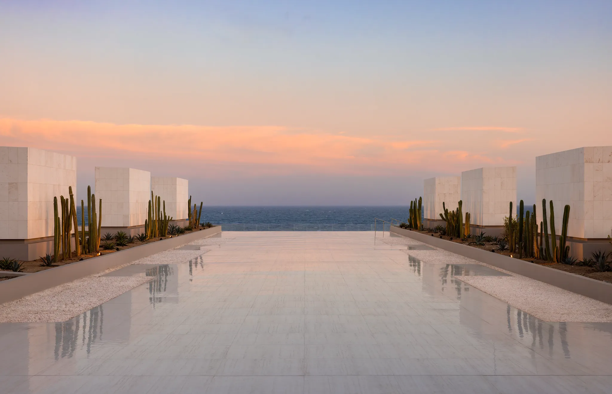 Oceanfront terrace at Secrets Baby Beach Aruba overlooking Baby Beach and the Caribbean Sea.