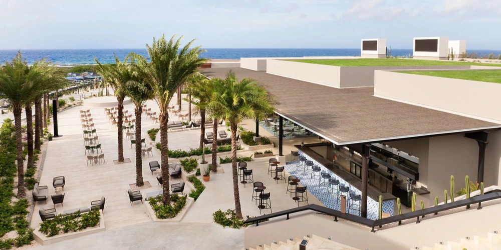 Market Cafe Terrace outdoor wedding setup overlooking the ocean at Secrets Baby Beach Aruba