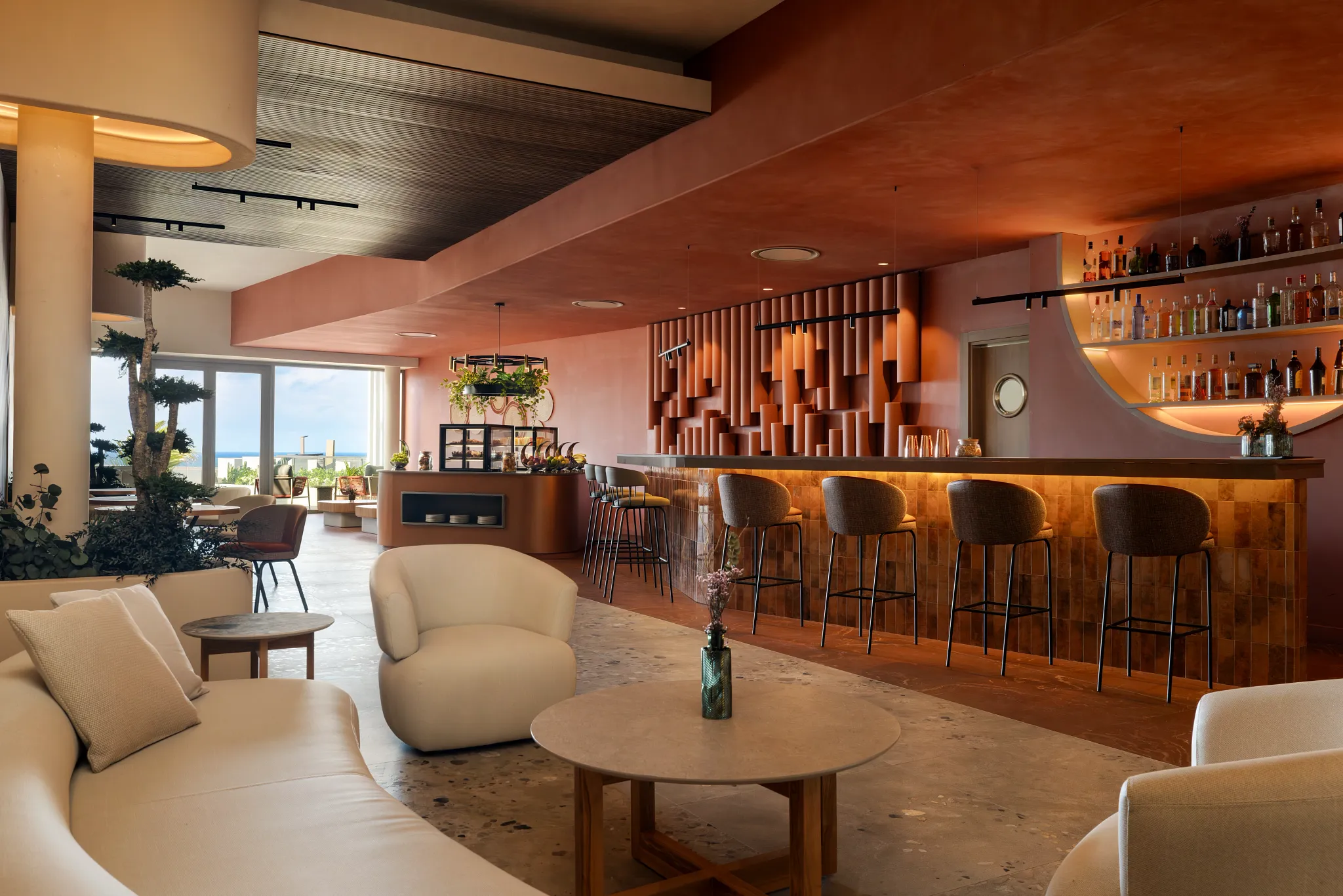 Preferred Club Bar at Secrets Baby Beach Aruba featuring an exclusive lounge with elegant seating, stylish bar, and ocean-view terrace.
