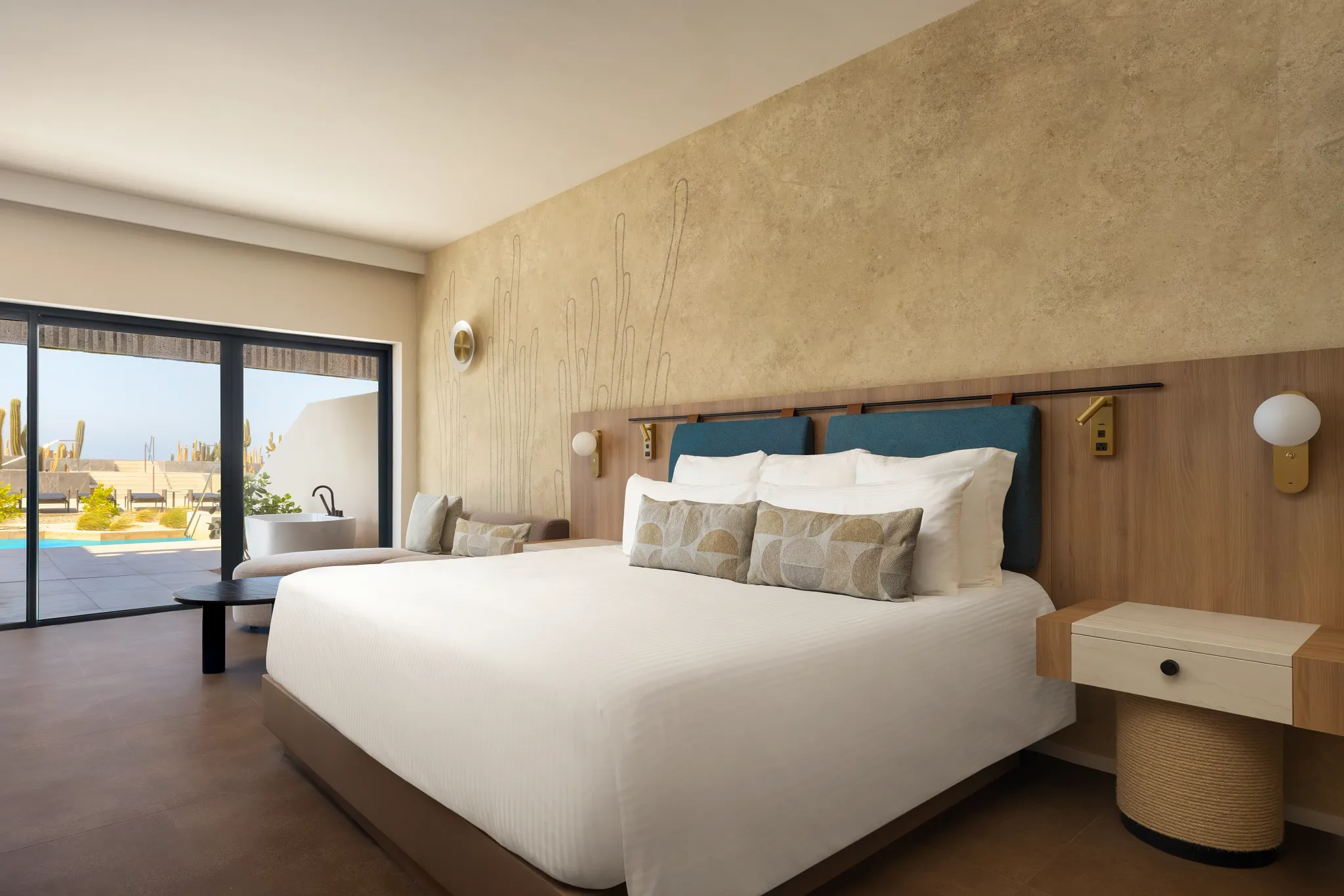 Preferred Club Junior Suite Private Pool with king-size bed and terrace access at Secrets Baby Beach Aruba.