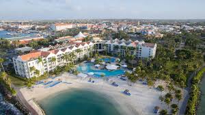 Renaissance Wind Creek Aruba Resort with marina views and access to private island beaches.